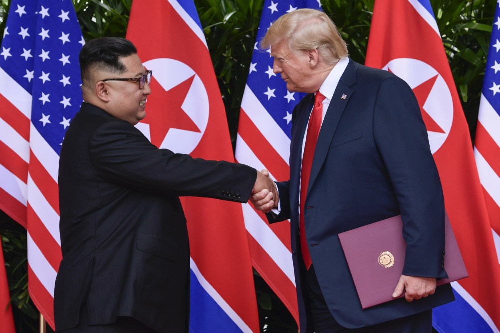 Trump and Kim shaking hands